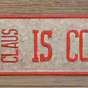 Santa Claus is coming Sign in distressed metal